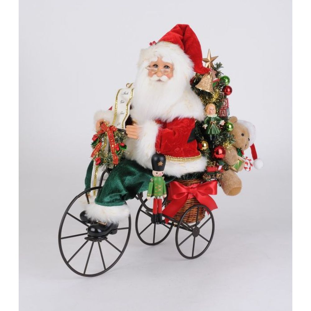 Karen Didion Lighted Biking Through Chrismas Santa Figurine