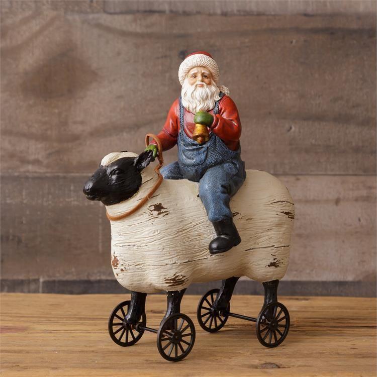Audrey's Your Heart's Delight Santa Riding Sheep, Resin by Audrey