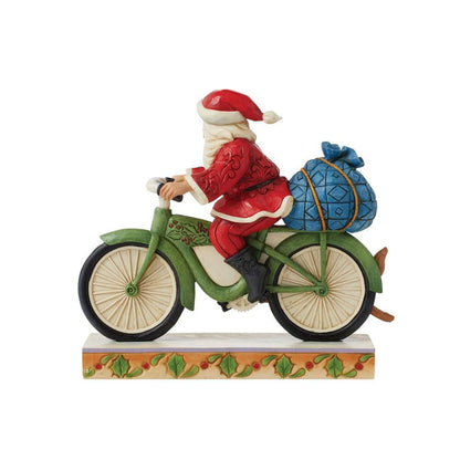 Enesco Jim Shore Heartwood Creek Santa Riding Bicycle Figurine